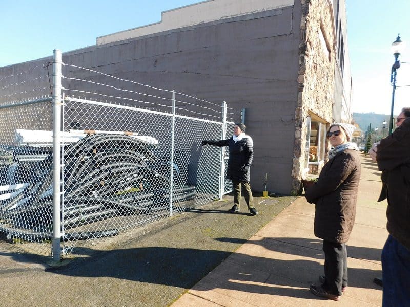 A chain link fence on a storage lot in a downtown