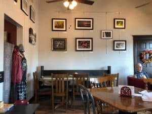 Coffee shop with local art displayed on the walls