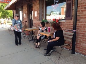 People chatting along a sidewalk in Columbia, Illinois