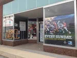 Empty building with windows advertising a satellite TV business