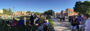 Concert-goers talking and enjoying the evening in downtown Webster City, Iowa.