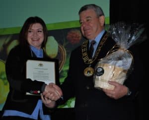 Jordan Stewart receives the Young Entrepreneur Award from Dennis Travale, Mayor of Norfolk County, Ontario.